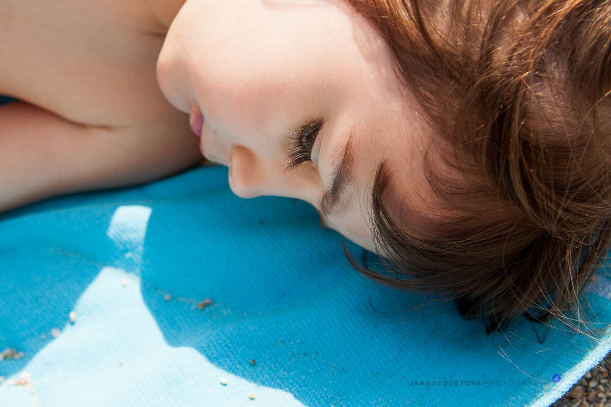 sleeping baby girl on the beach
