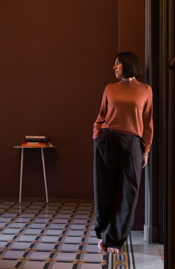 standing woman leaning on the door