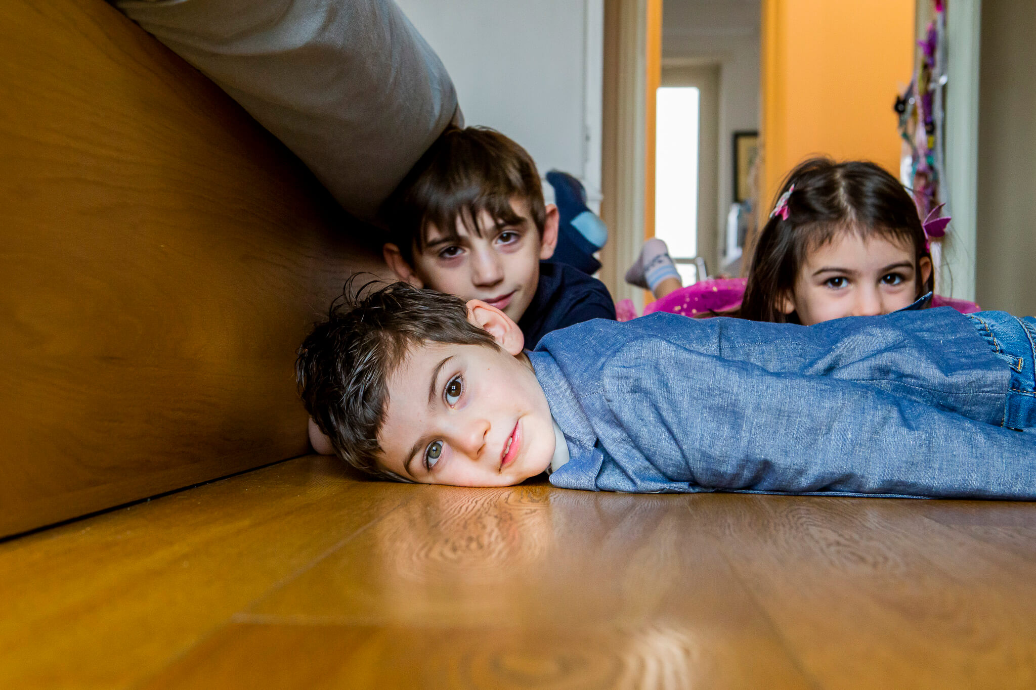 Three adult sisters with their mother chatting in front of the front door