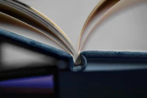 A close-up of a high-quality photo book with pages fanned out. A close-up of a high-quality photo book with pages fanned out.