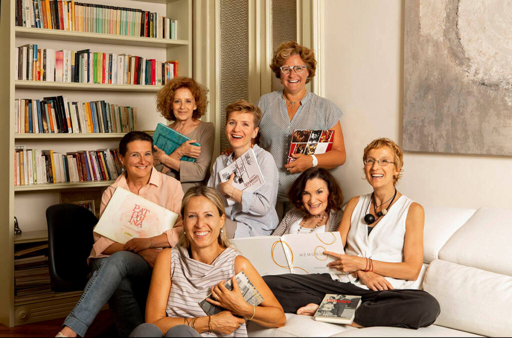 group of women with a book in a cozy living room
